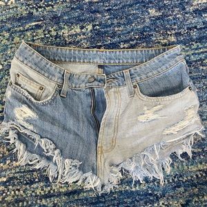 TWO pairs of low waisted denim shorts size 27